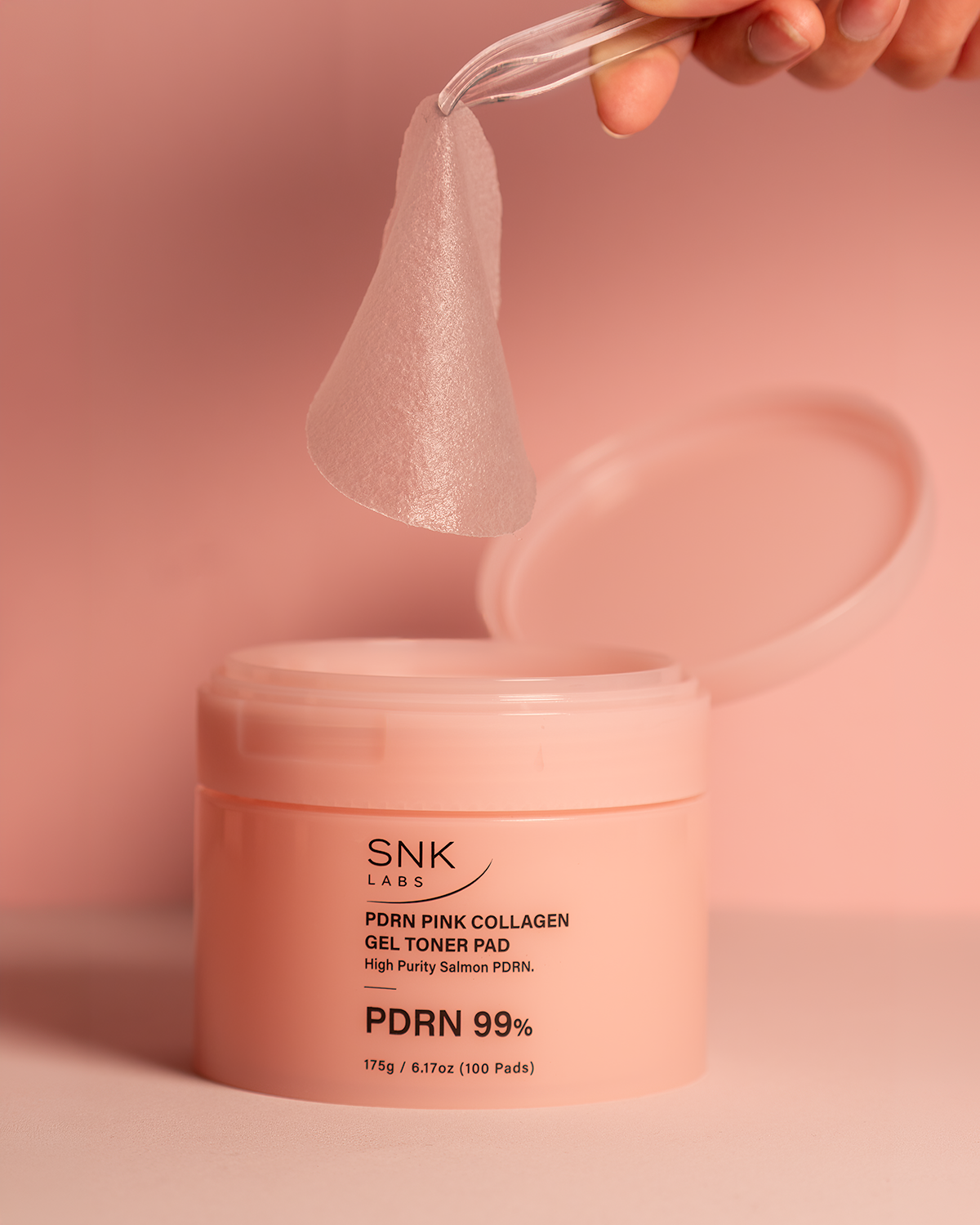 Close-up of the SNK Labs PDRN Pink Collagen Gel Toner Pad
